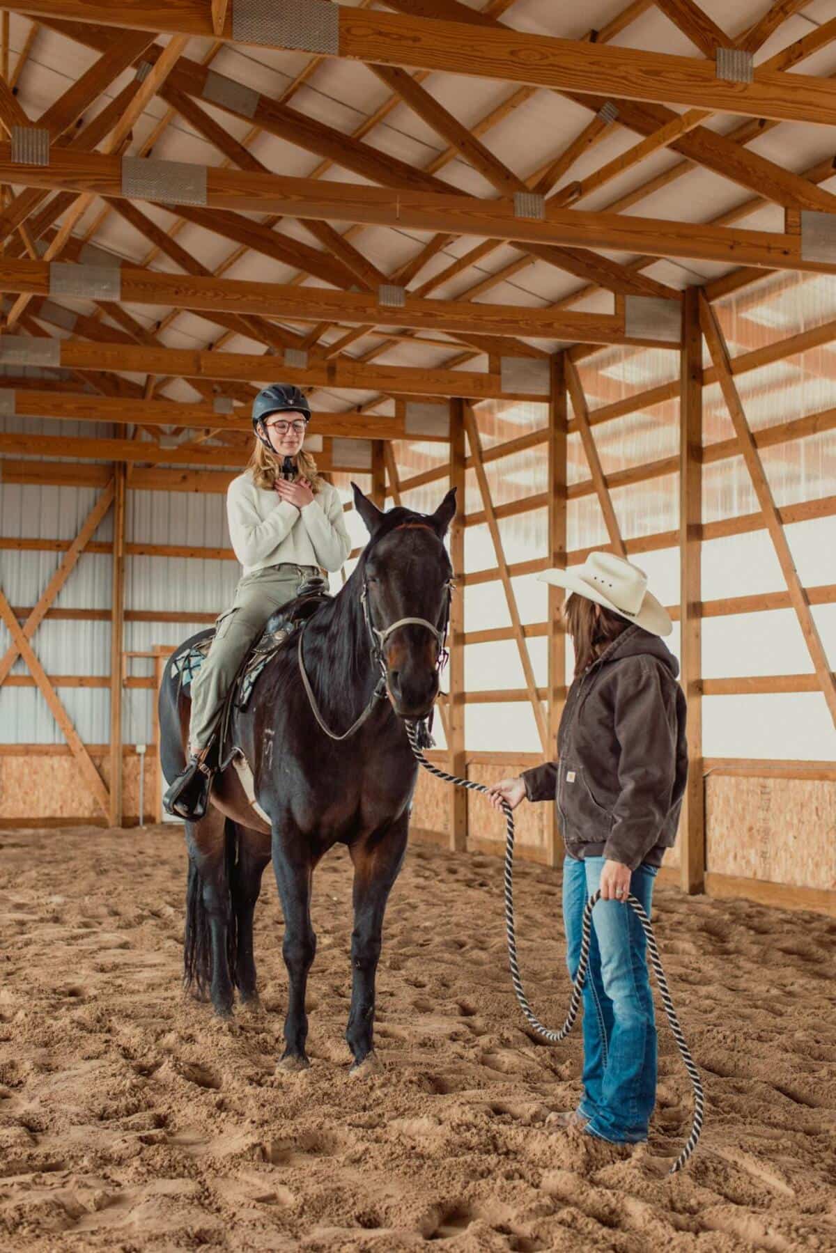 Teen girl horseback riding during equine therapy at Juniper Haven